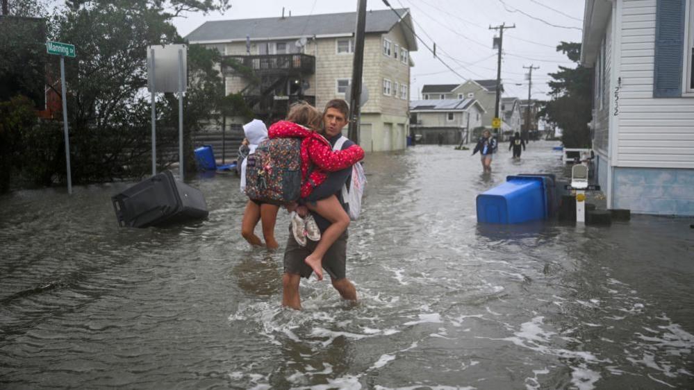 Storm Smashes East Coast: 1 Dead, Flooding, Games Cancelled