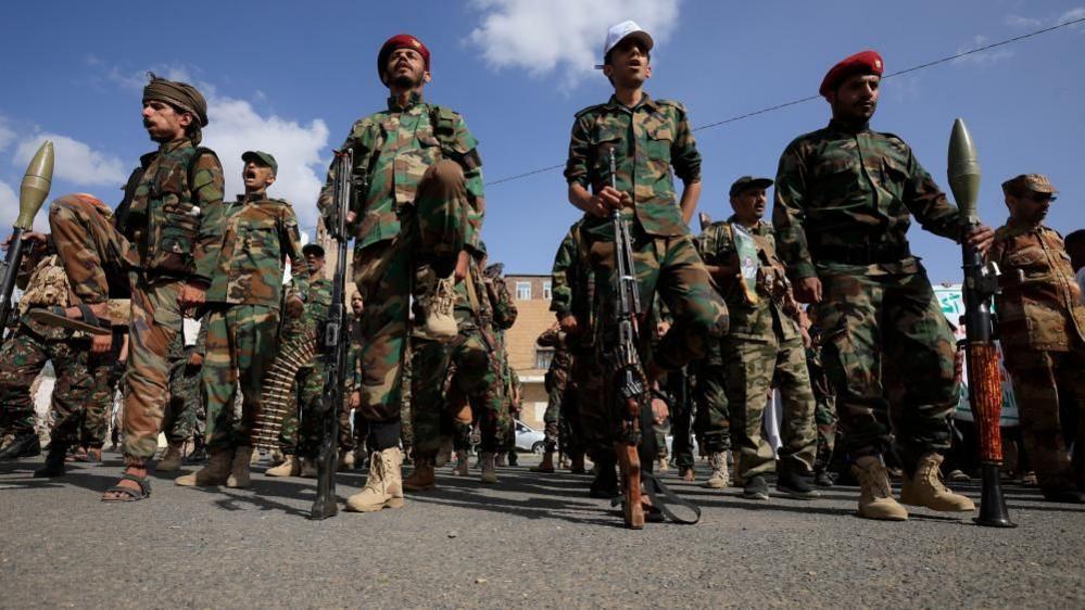 Houthi fighters on a small island