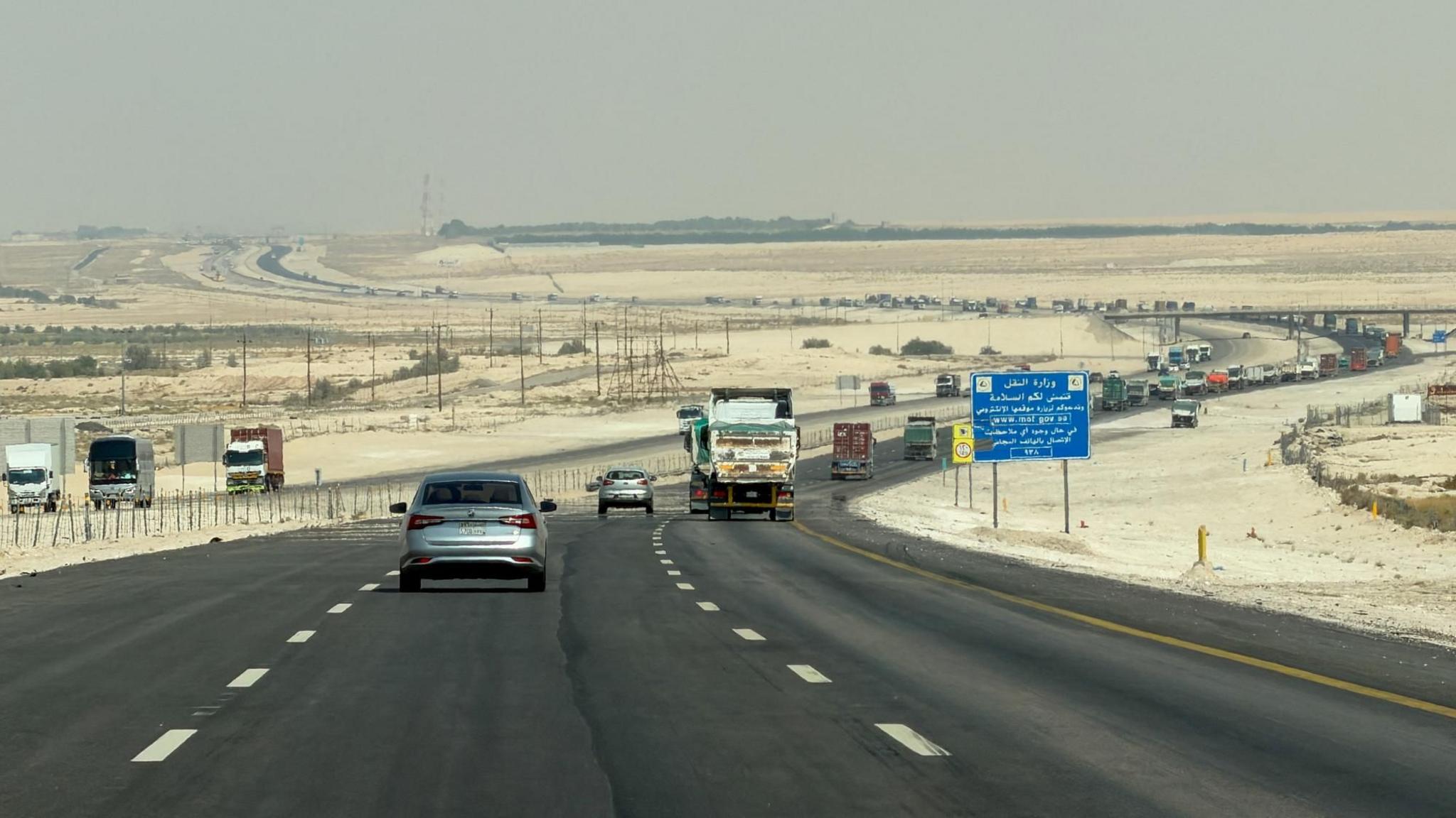 Cars and trucks on Dammam-Riyadh Highway in Saudi Arabia