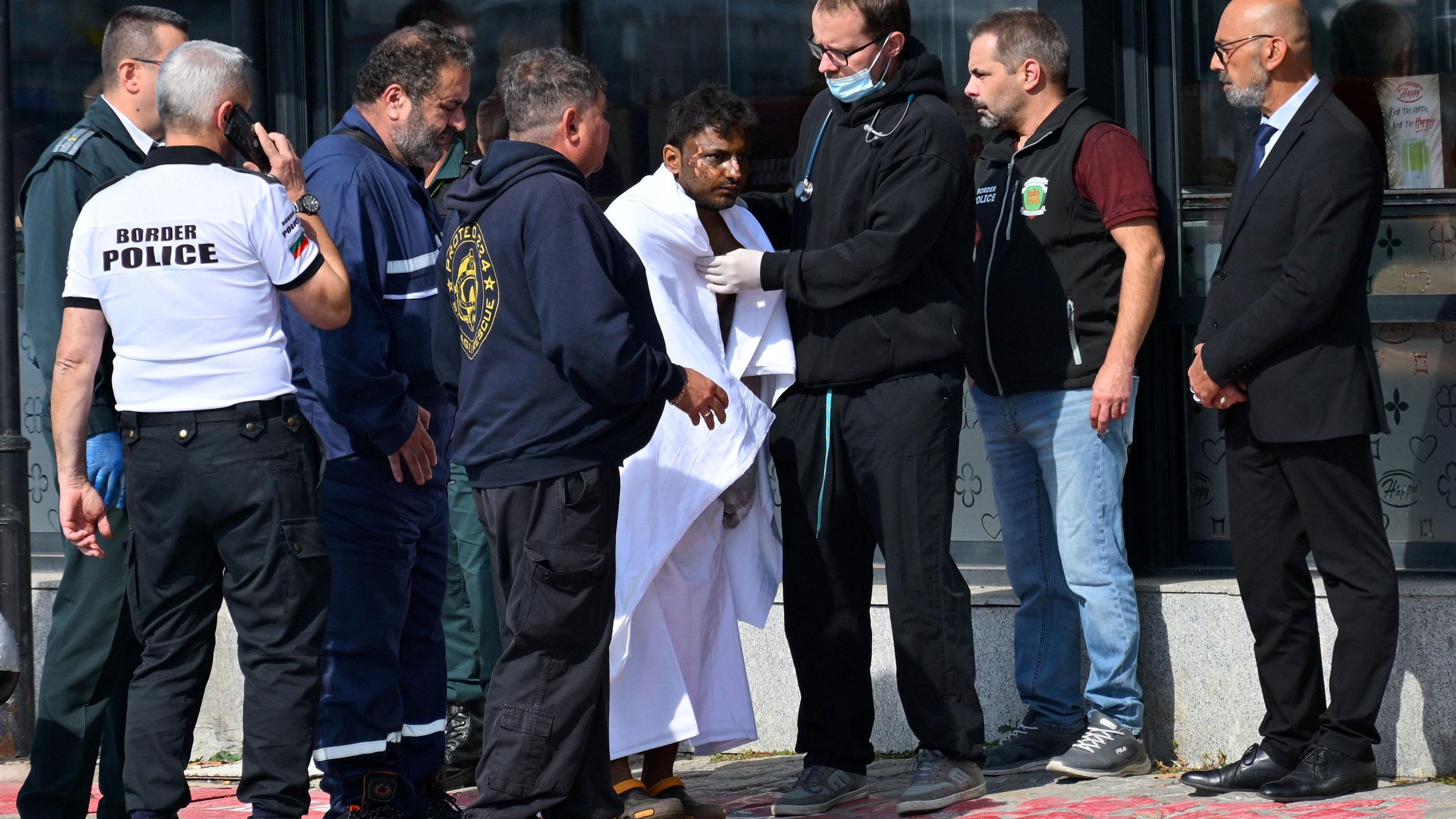 Refugee white blanket rescue on a ship