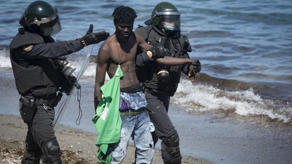 Hundreds of migrants swim from Morocco to Spanish enclave of Ceuta