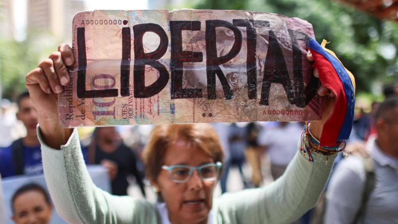 Venezuela protester with sign