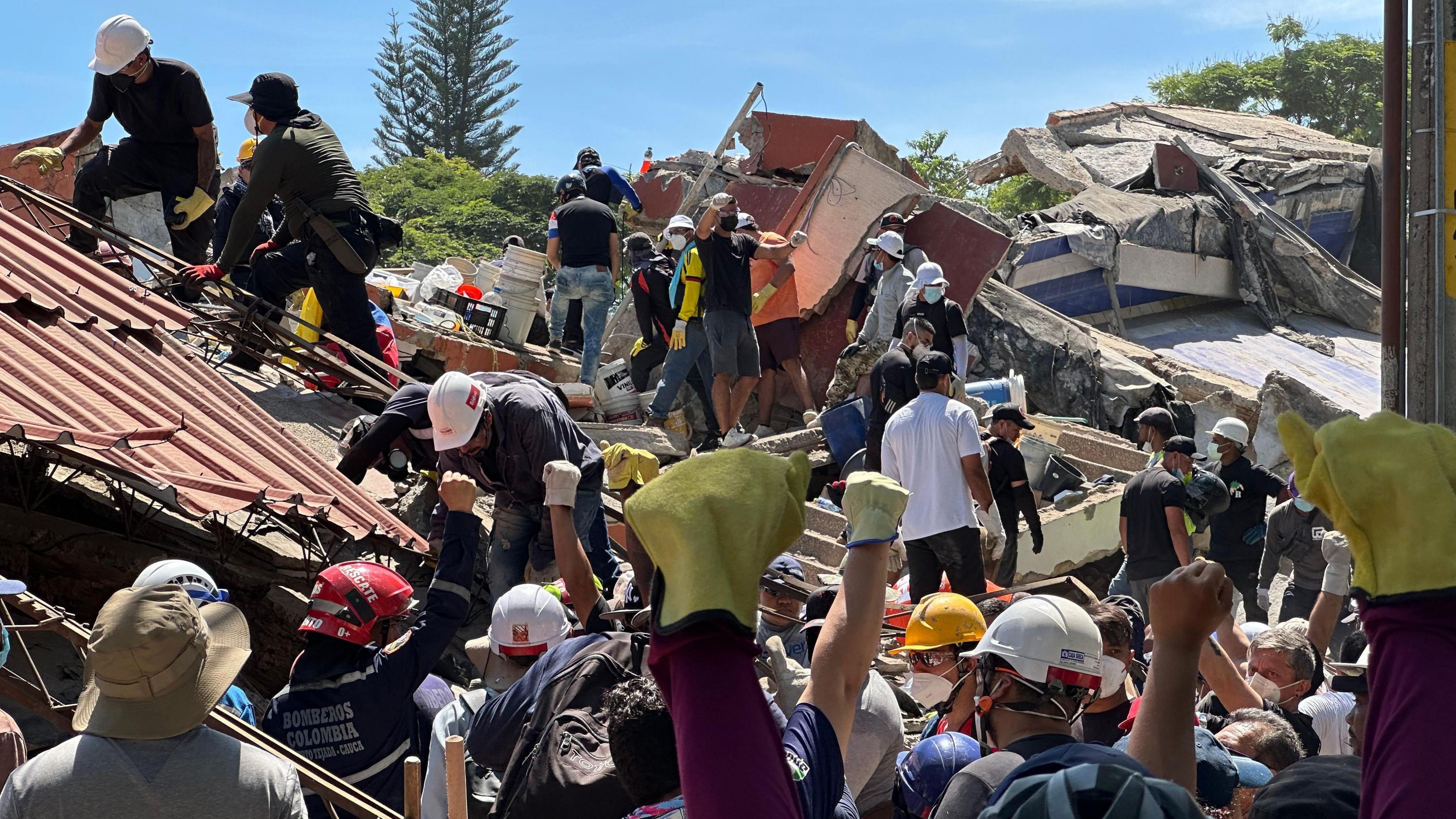 Brother Hangs Hope on the Edge of Rubble