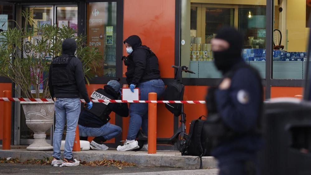 Police inspecting the scene in Trappes