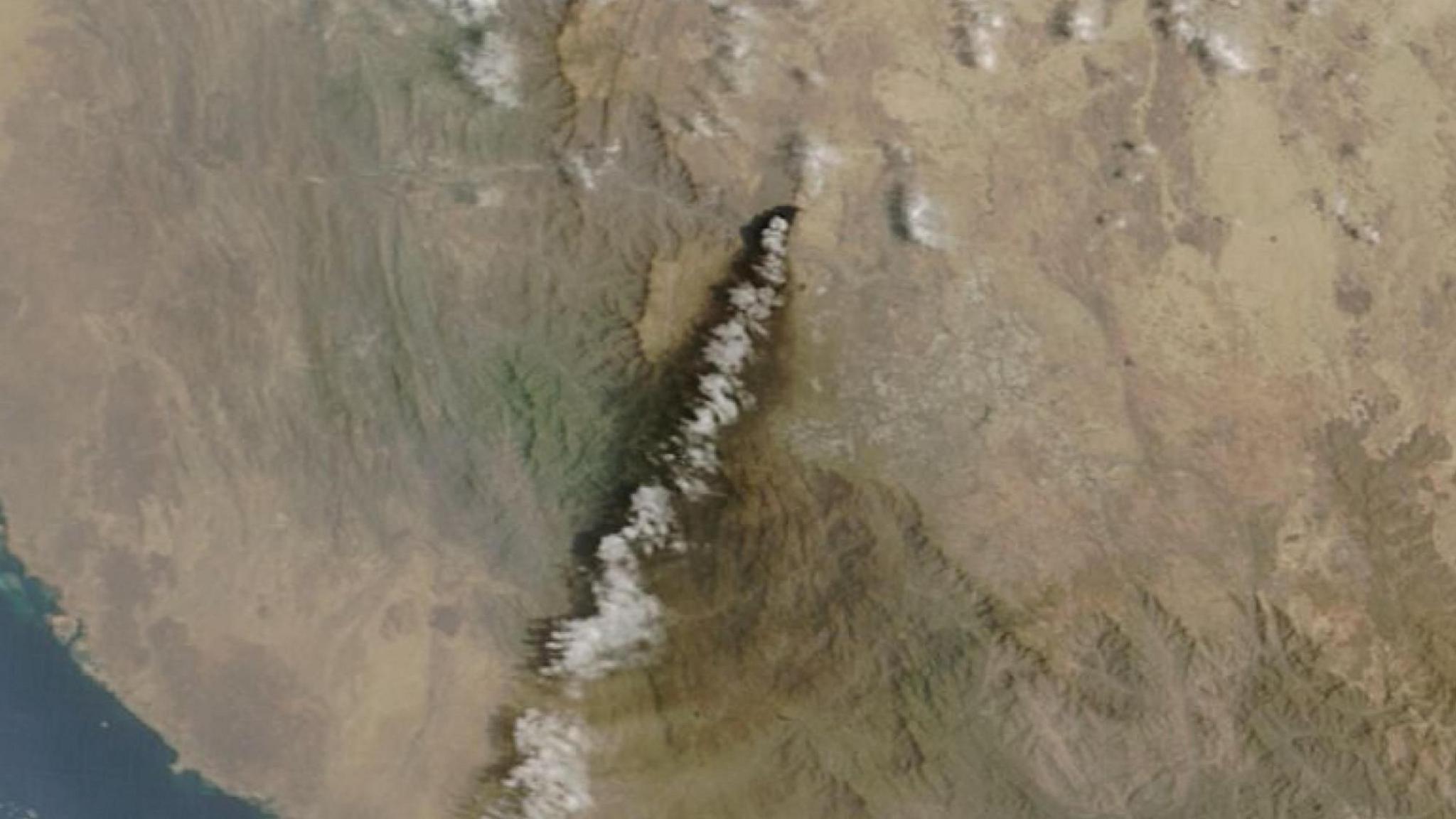 Satellite image of smoke rising from Saudi Aramco plant