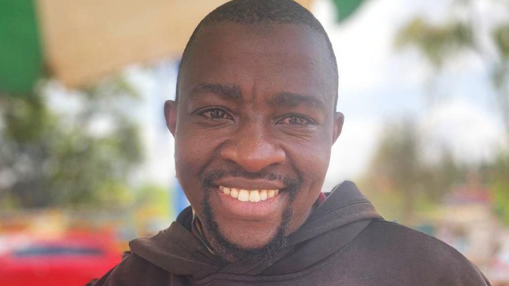 Simon Macharia Wangũi in a black hoodie
