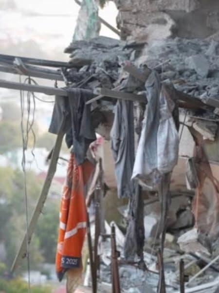 Roland Garros towel hanging from burnt building in Odesa