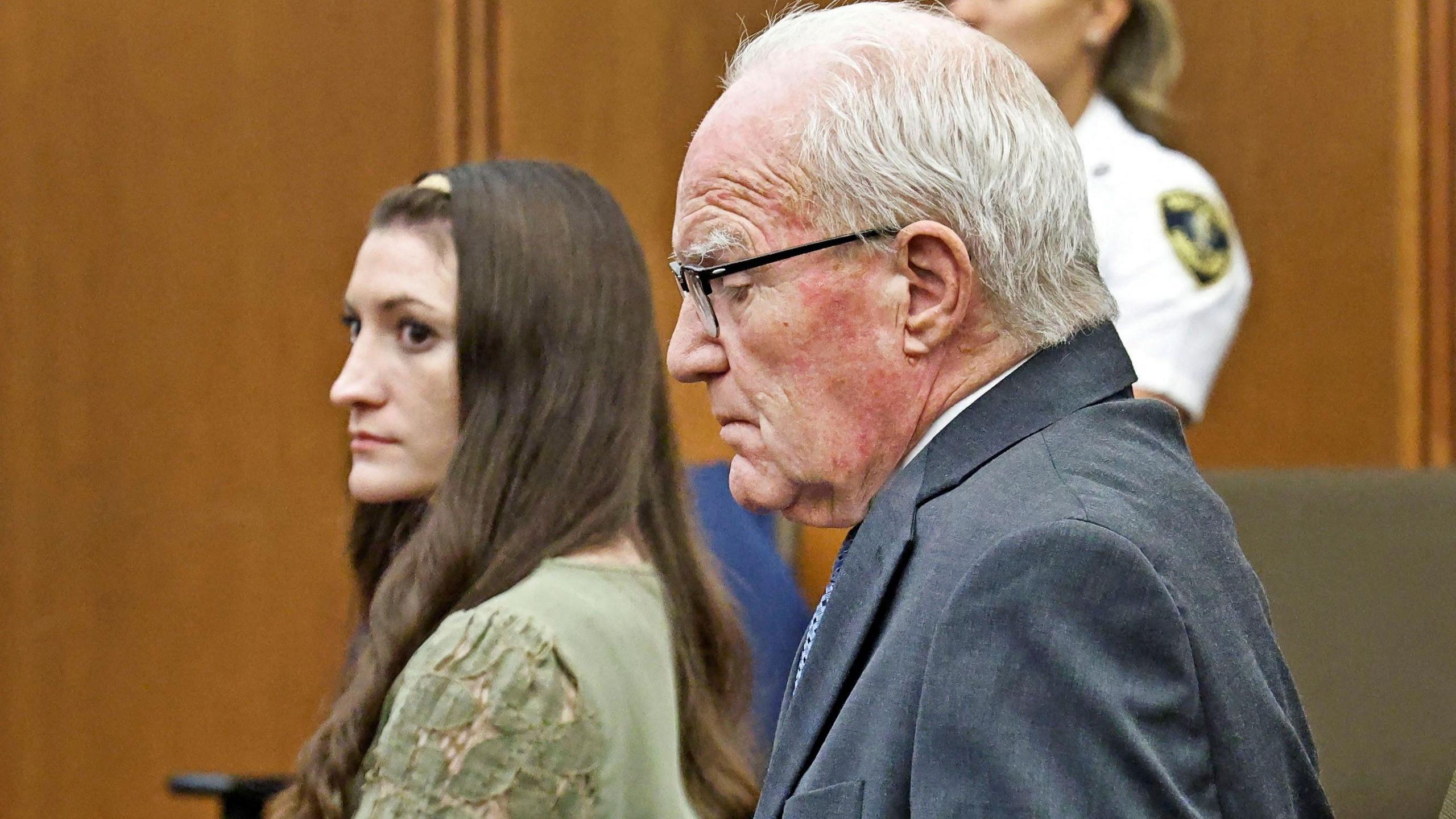 Lindsay Clancy sits with her attorney in court